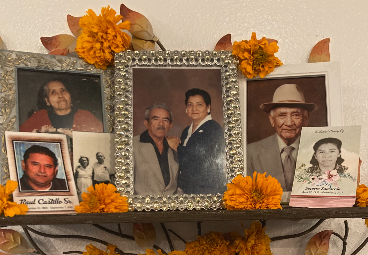 A family altar with photographs and marigolds